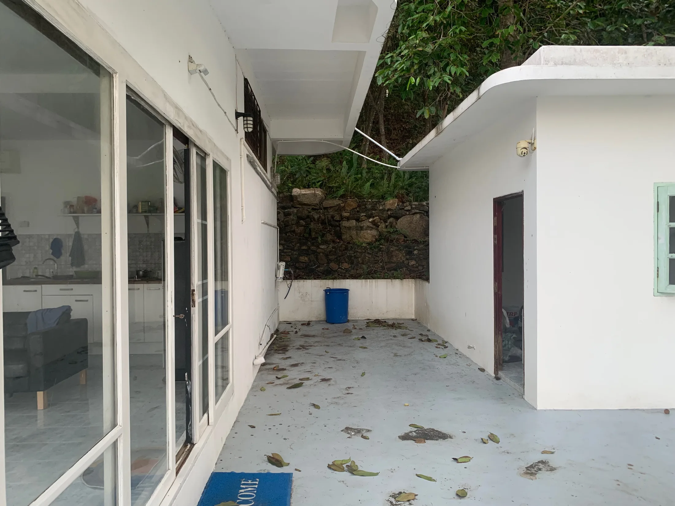 Courtyard and rear service area around the existing Haad Salad house