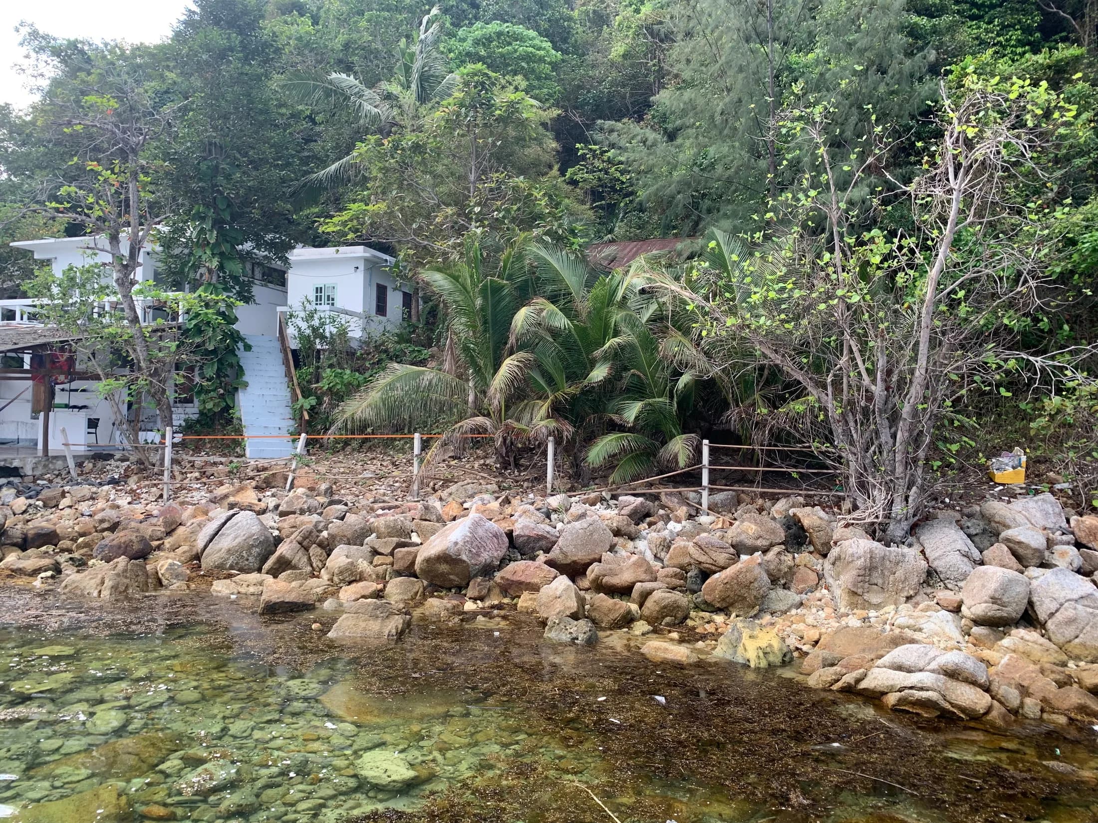 Existing waterfront house seen from the water at Haad Salad