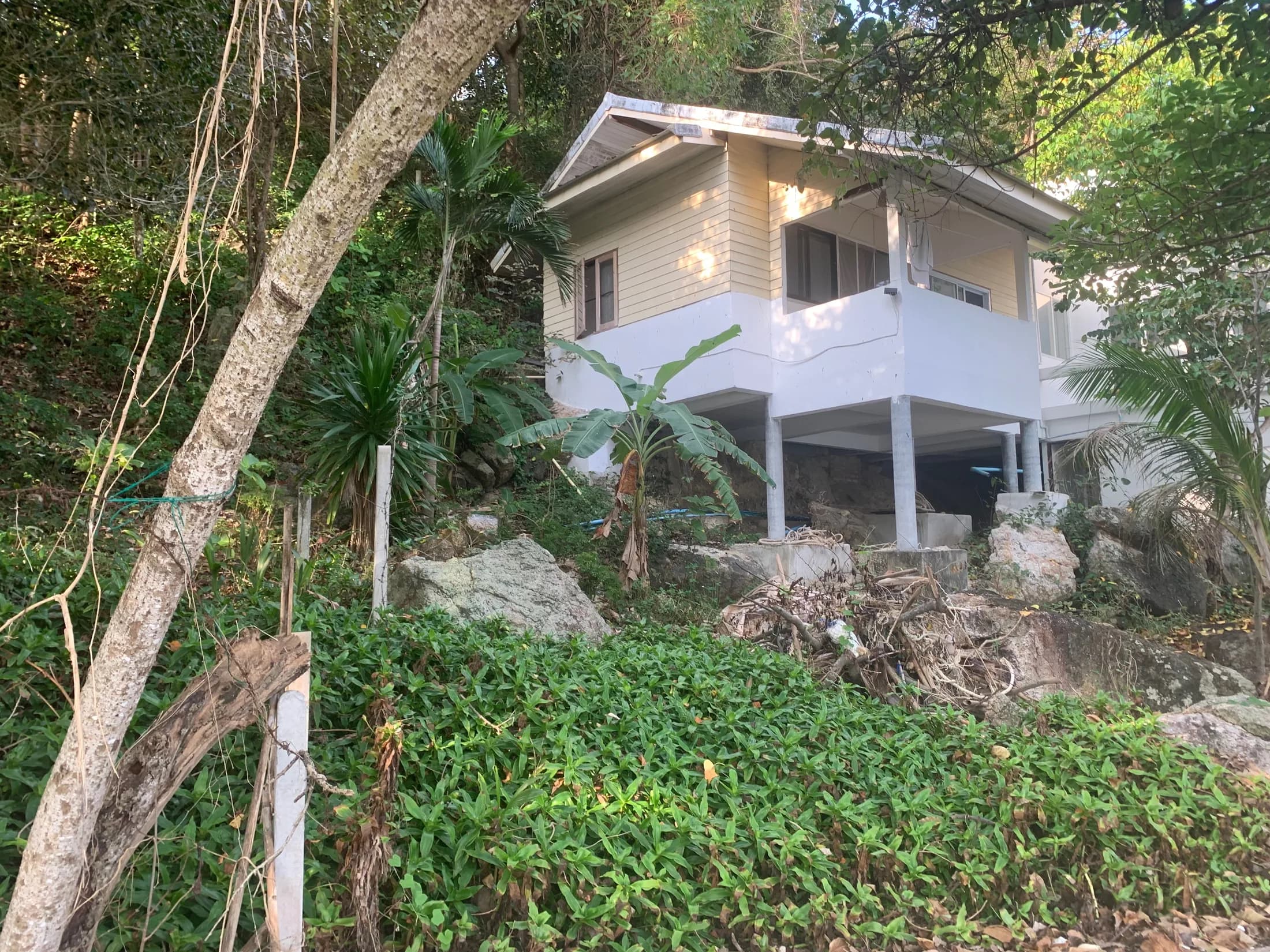 Existing older waterfront house on posts at Haad Salad