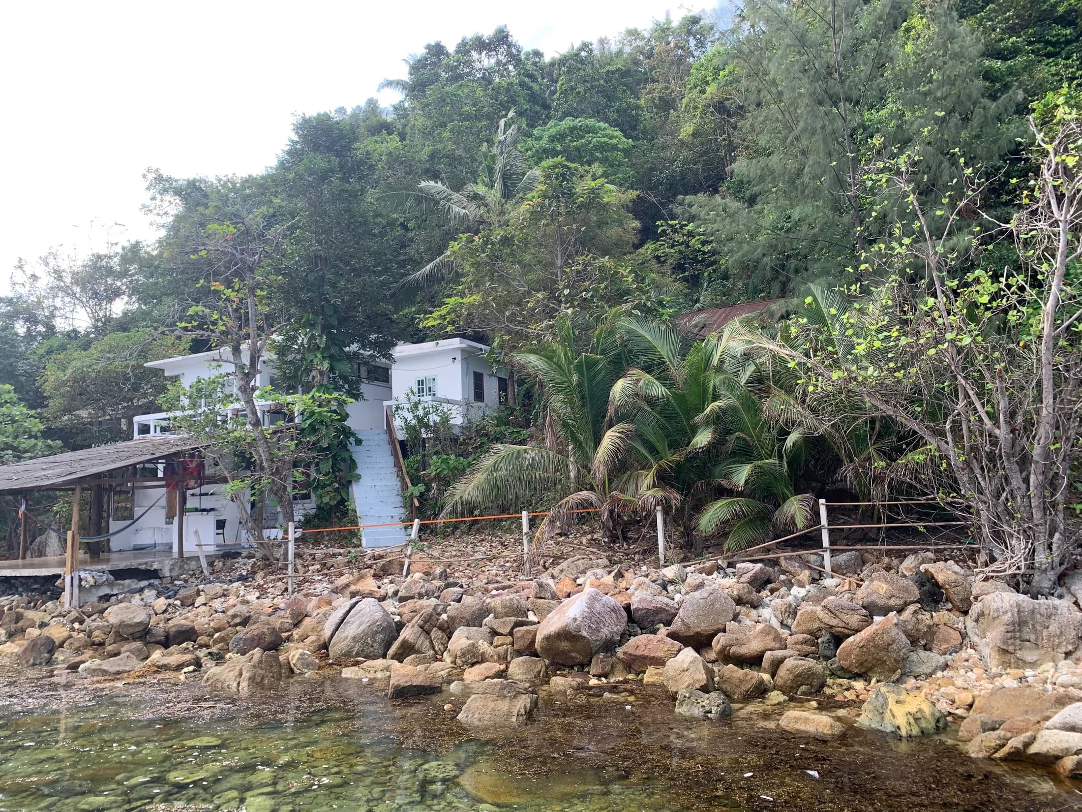 View from the water toward the steep Haad Salad land and existing house